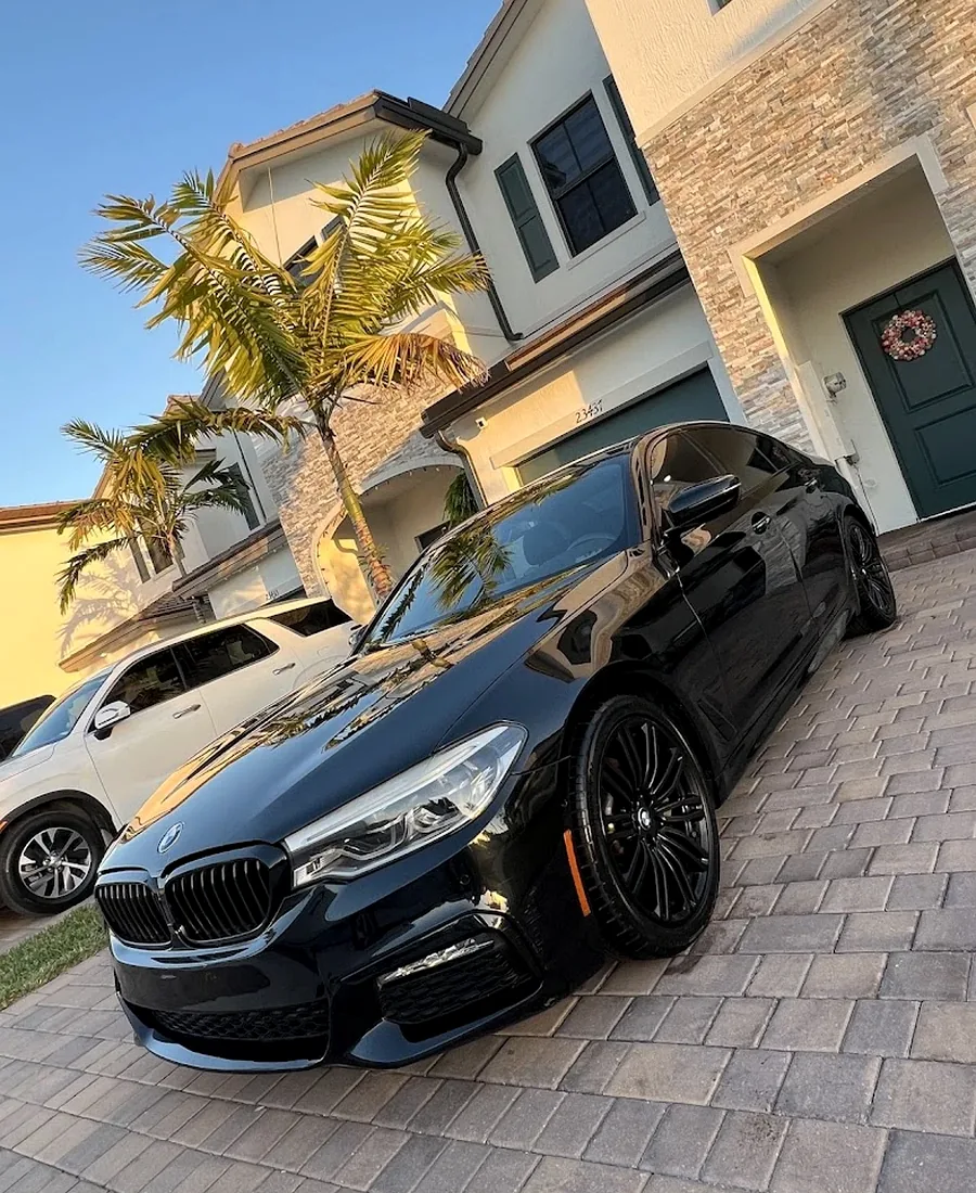 Real Black BMW 5 Series M-Sport detailed on a Miami driveway by Perfect Shine 305